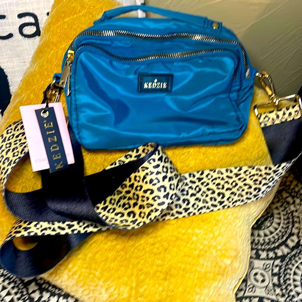 Kedzie cross body Belt Bag. Teal with leopard guitar strap. New with tags.